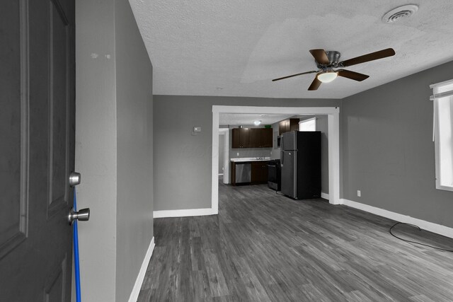 820 Poplar St Unit 820/822, Nelsonville, OH 45764 - unfurnished living room featuring visible vents, dark wood-style floors, baseboards, and ceiling fan