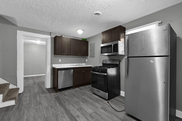 820 Poplar St Unit 820/822, Nelsonville, OH 45764 - kitchen with visible vents, wood finished floors, appliances with stainless steel finishes, and dark brown cabinets