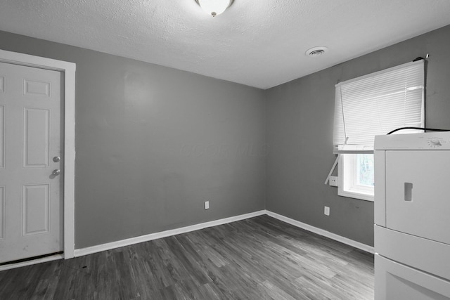 820 Poplar St Unit 820/822, Nelsonville, OH 45764 - unfurnished room with baseboards, dark wood-style floors, washer / clothes dryer, and visible vents