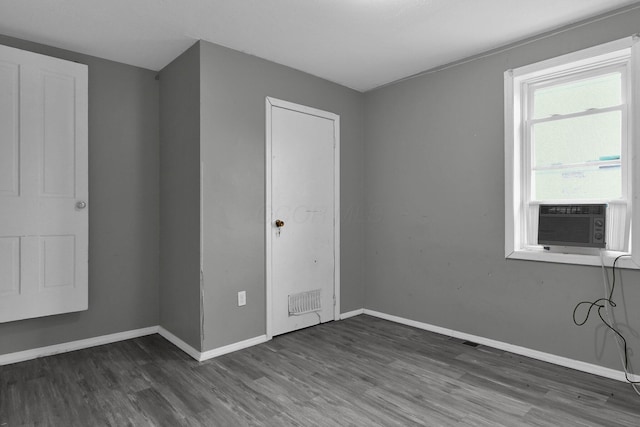 820 Poplar St Unit 820/822, Nelsonville, OH 45764 - unfurnished room with baseboards, dark wood-style floors, and visible vents