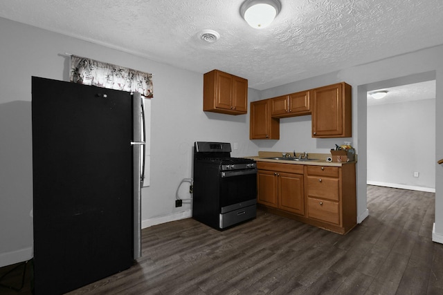 820 Poplar St Unit 820/822, Nelsonville, OH 45764 - kitchen featuring light countertops, visible vents, stainless steel appliances, and dark wood finished floors