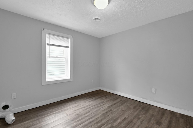 820 Poplar St Unit 820/822, Nelsonville, OH 45764 - unfurnished room with baseboards, visible vents, wood finished floors, and a textured ceiling