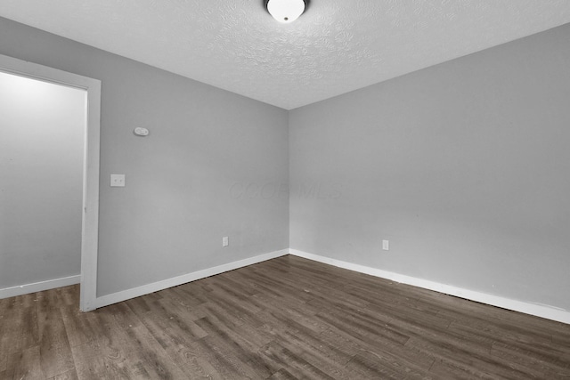 820 Poplar St Unit 820/822, Nelsonville, OH 45764 - unfurnished room featuring a textured ceiling, baseboards, and wood finished floors