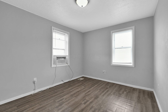 820 Poplar St Unit 820/822, Nelsonville, OH 45764 - empty room featuring visible vents, dark wood-type flooring, baseboards, and a textured ceiling