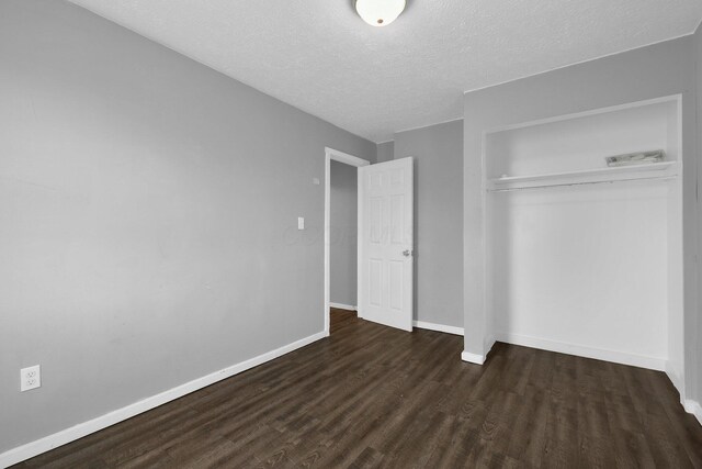 820 Poplar St Unit 820/822, Nelsonville, OH 45764 - unfurnished bedroom with a closet, a textured ceiling, baseboards, and wood finished floors