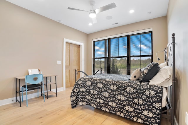 bedroom featuring recessed lighting, wood finished floors, visible vents, and baseboards