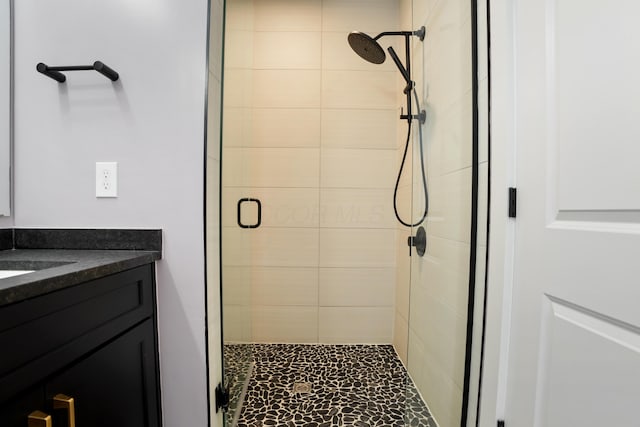 full bathroom with vanity and a shower stall