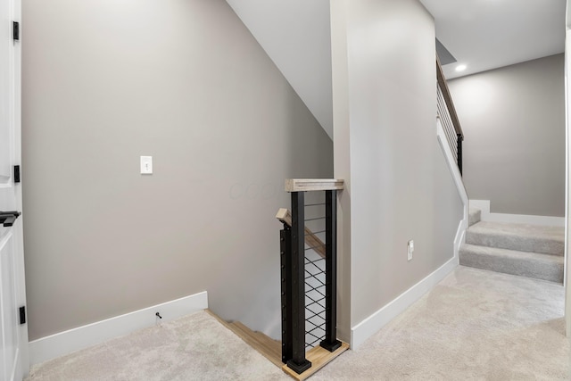 stairs with baseboards, carpet floors, and recessed lighting