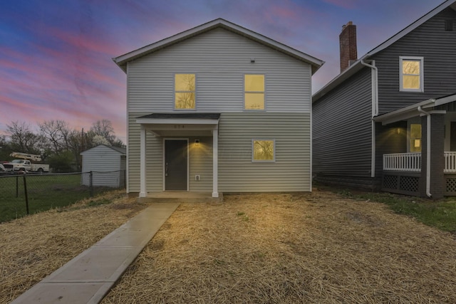 574 Koebel Ave, Columbus, OH 43207 - back of house at dusk featuring fence