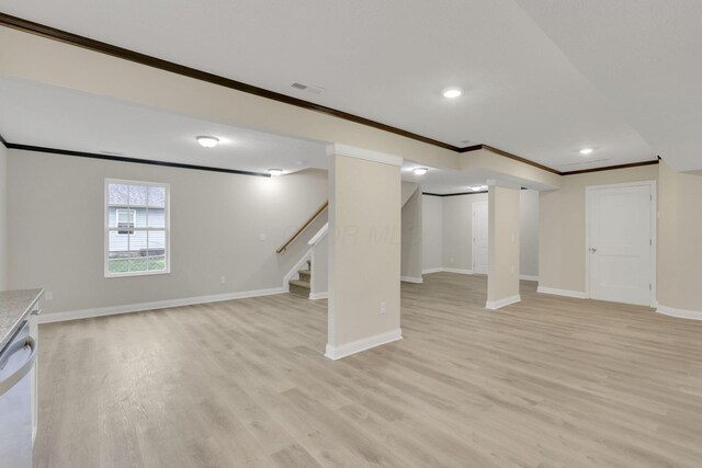 574 Koebel Ave, Columbus, OH 43207 - below grade area featuring light wood finished floors, stairs, crown molding, and baseboards