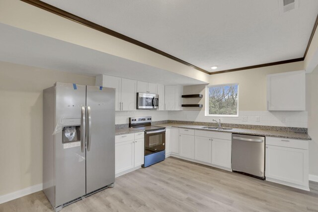 574 Koebel Ave, Columbus, OH 43207 - kitchen with open shelves, stainless steel appliances, a sink, visible vents, and white cabinets