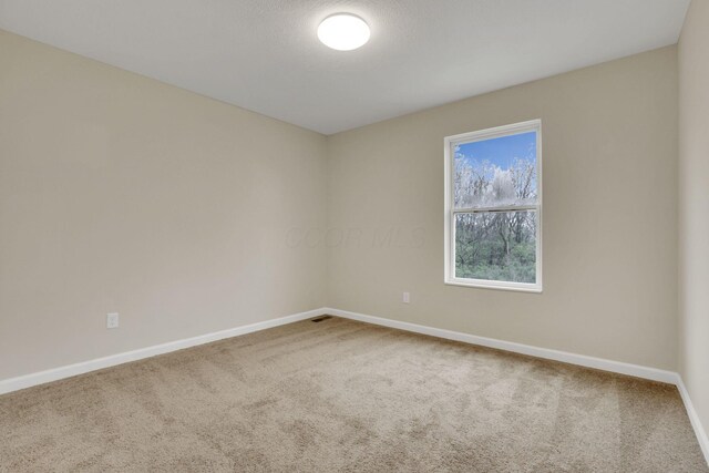 574 Koebel Ave, Columbus, OH 43207 - carpeted spare room with baseboards
