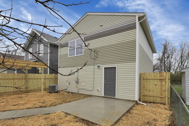 574 Koebel Ave, Columbus, OH 43207 - back of house with fence, a patio area, and central AC