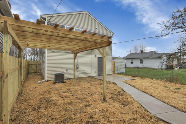 574 Koebel Ave, Columbus, OH 43207 - view of yard featuring central air condition unit, a fenced backyard, and a pergola