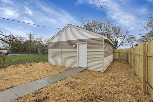 574 Koebel Ave, Columbus, OH 43207 - view of outbuilding with a fenced backyard and an outdoor structure
