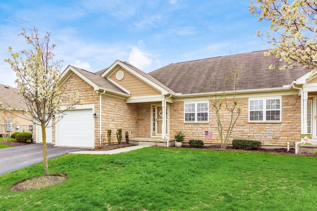 ranch-style home featuring a garage, driveway, stone siding, and a front yard