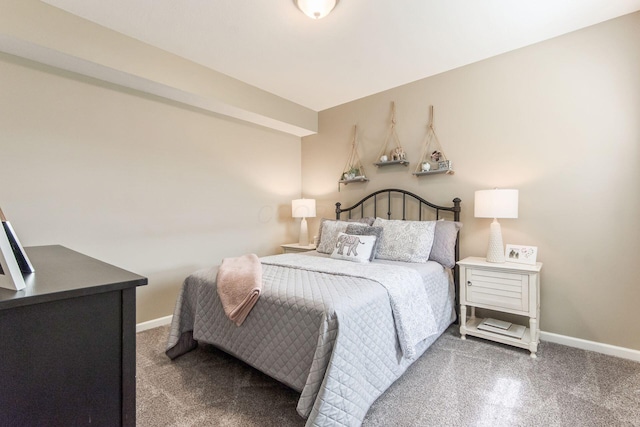 carpeted bedroom with baseboards