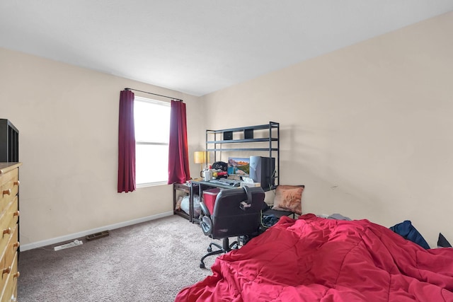 carpeted bedroom featuring baseboards