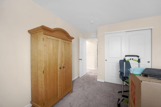 office space featuring carpet flooring, baseboards, and visible vents