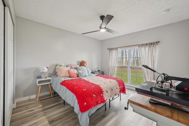 21100 Fleckinger Rd, West Mansfield, OH 43358 - bedroom featuring wood finished floors, baseboards, and a ceiling fan