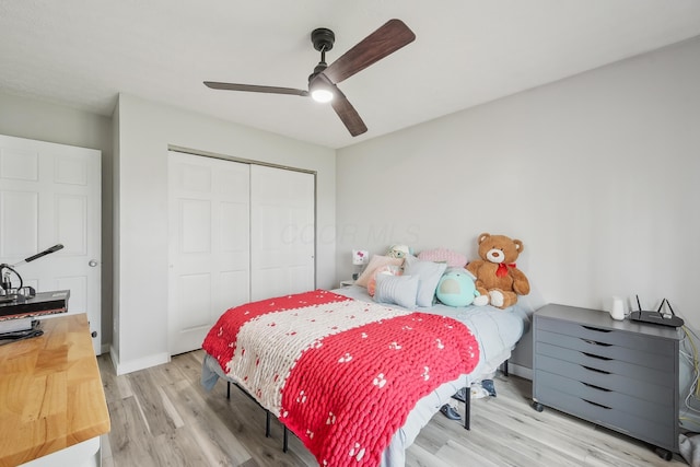 21100 Fleckinger Rd, West Mansfield, OH 43358 - bedroom featuring a closet, light wood finished floors, baseboards, and a ceiling fan