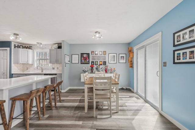 21100 Fleckinger Rd, West Mansfield, OH 43358 - dining space featuring light wood-type flooring and baseboards