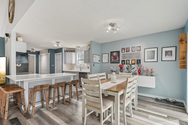 21100 Fleckinger Rd, West Mansfield, OH 43358 - dining space with light wood-style flooring and baseboards