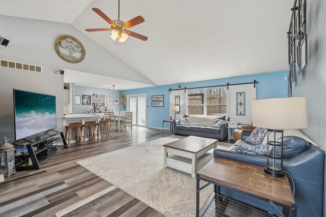 21100 Fleckinger Rd, West Mansfield, OH 43358 - living room featuring high vaulted ceiling, visible vents, wood finished floors, and ceiling fan