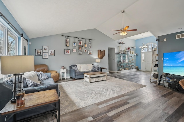 21100 Fleckinger Rd, West Mansfield, OH 43358 - living room with visible vents, lofted ceiling, wood finished floors, and ceiling fan with notable chandelier
