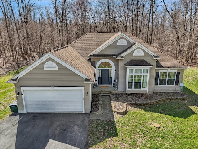 21100 Fleckinger Rd, West Mansfield, OH 43358 - view of front facade featuring roof with shingles, aphalt driveway, a garage, and a front yard