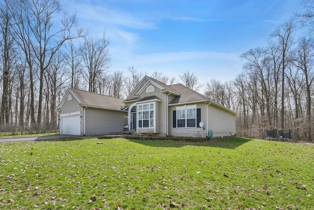 21100 Fleckinger Rd, West Mansfield, OH 43358 - view of front of home with an attached garage, aphalt driveway, and a front yard