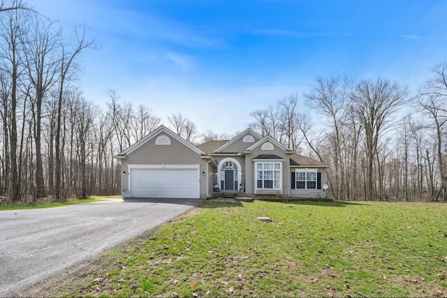 21100 Fleckinger Rd, West Mansfield, OH 43358 - view of front of house featuring an attached garage, driveway, and a front lawn