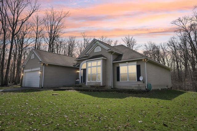 21100 Fleckinger Rd, West Mansfield, OH 43358 - view of front of property with roof with shingles, a garage, concrete driveway, and a front lawn