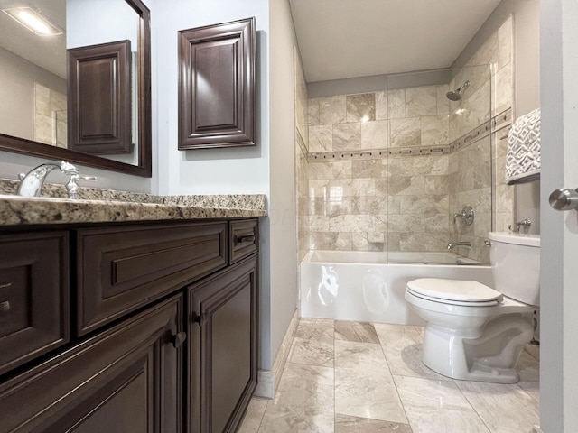 bathroom with vanity, baseboards, toilet, and shower / tub combination