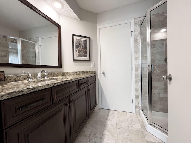 full bath featuring vanity and a stall shower
