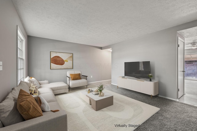 1006 Hardesty Pl W, Columbus, OH 43204 - living area featuring carpet, a textured ceiling, and baseboards