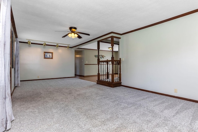 1738 W Chestnut St, Lancaster, OH 43130 - carpeted empty room with ornamental molding, ceiling fan, baseboards, and a textured ceiling