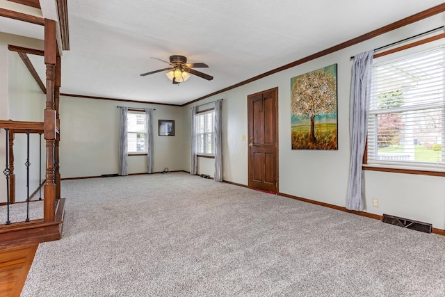 1738 W Chestnut St, Lancaster, OH 43130 - carpeted spare room featuring visible vents, baseboards, a ceiling fan, and ornamental molding