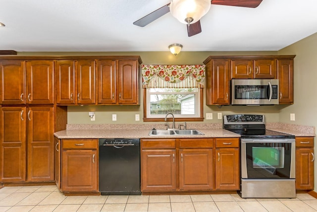 1738 W Chestnut St, Lancaster, OH 43130 - kitchen with light countertops, appliances with stainless steel finishes, a sink, and a ceiling fan