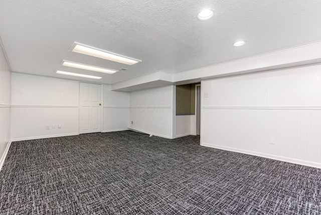 1738 W Chestnut St, Lancaster, OH 43130 - finished basement with dark carpet, a wainscoted wall, recessed lighting, and a textured ceiling