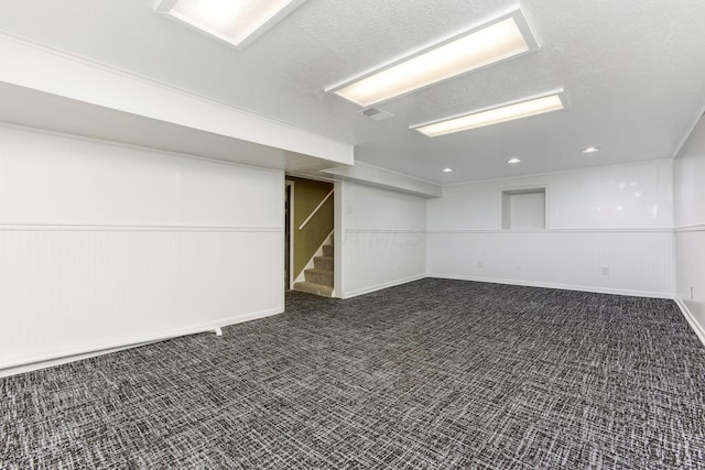 1738 W Chestnut St, Lancaster, OH 43130 - finished basement featuring a textured ceiling, dark colored carpet, visible vents, and recessed lighting