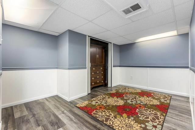 1738 W Chestnut St, Lancaster, OH 43130 - empty room with wainscoting, visible vents, a drop ceiling, and wood finished floors