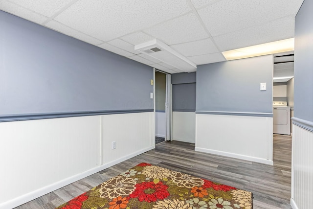 1738 W Chestnut St, Lancaster, OH 43130 - unfurnished room featuring washer / dryer, a drop ceiling, visible vents, and wood finished floors