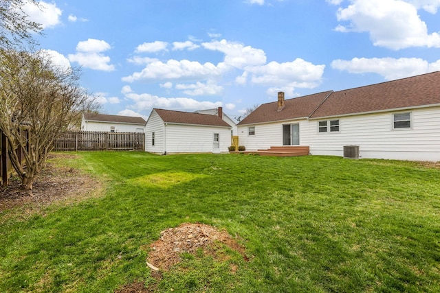 1738 W Chestnut St, Lancaster, OH 43130 - rear view of property with an outdoor structure, central air condition unit, a fenced backyard, and a lawn