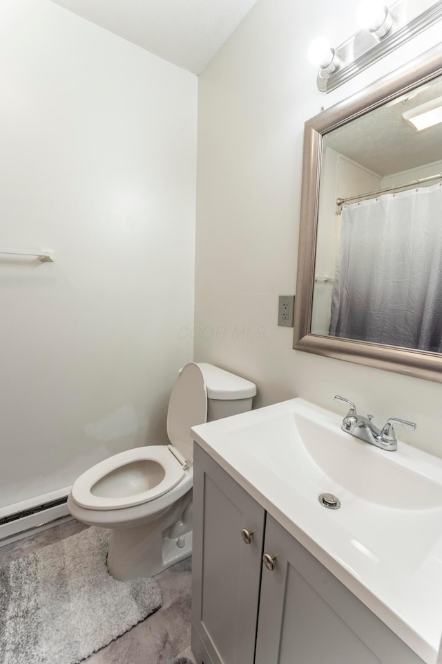 full bath with toilet and vanity