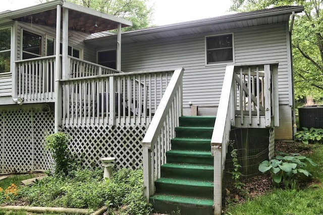 2406 Apple Valley Dr, Howard, OH 43028 - doorway to property with central AC unit and a wooden deck