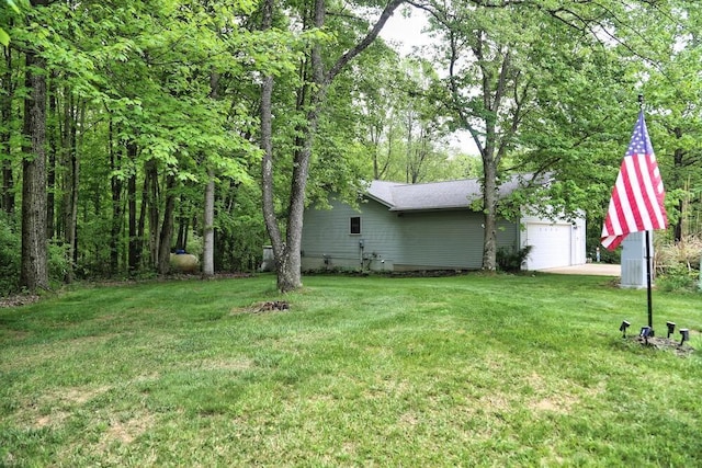 2406 Apple Valley Dr, Howard, OH 43028 - view of grassy yard featuring a garage