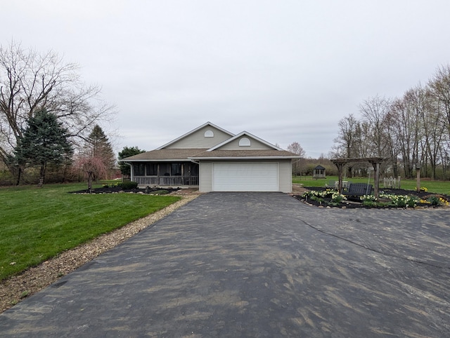view of front of property featuring a pergola, aphalt driveway, covered porch, a front yard, and an attached garage