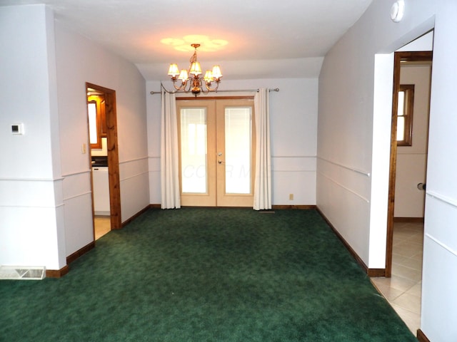 unfurnished room featuring baseboards, a chandelier, french doors, and visible vents