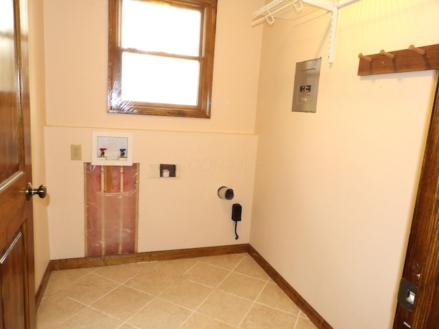 washroom featuring washer hookup, hookup for an electric dryer, laundry area, light tile patterned floors, and baseboards